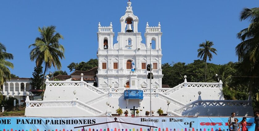 Statue of Virgin Mary in front and the bell tower on top. Panjim - A guide to diverse places to visit in Panjim at night