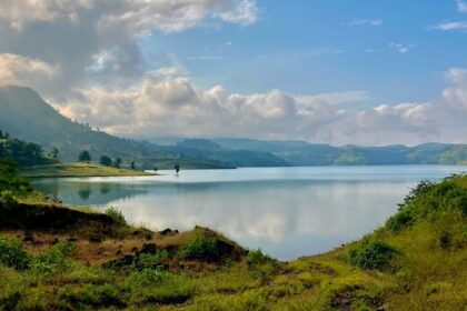 An image of Nashik’s beautiful landscape showcases vineyards and rolling hills.