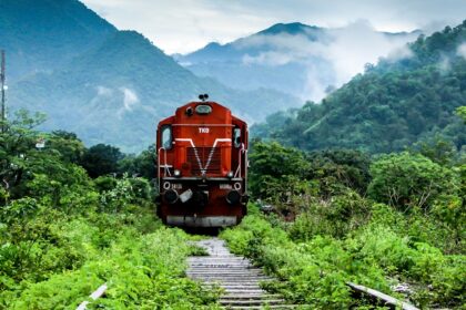 Image of a train amidst lush green surroundings - places to vsiit near Kathgodam