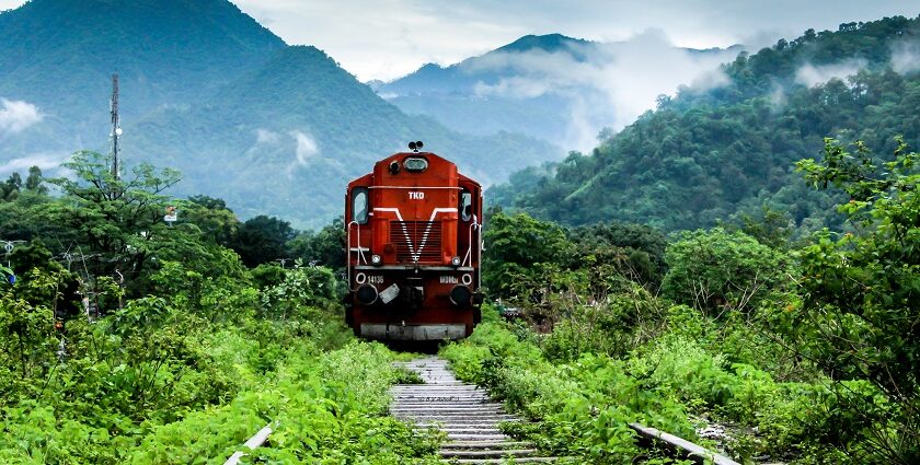 Image of a train amidst lush green surroundings - places to vsiit near Kathgodam