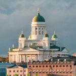 An Image of Finland amidst greenery and a calm sea, taken from the Helsinki.