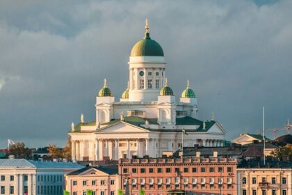 An Image of Finland amidst greenery and a calm sea, taken from the Helsinki.