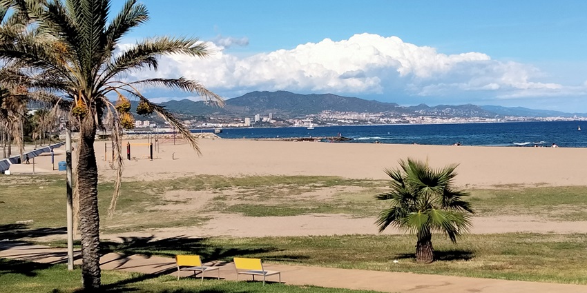 Image of gentle waves touch the sand at Platja del Forum during day time view