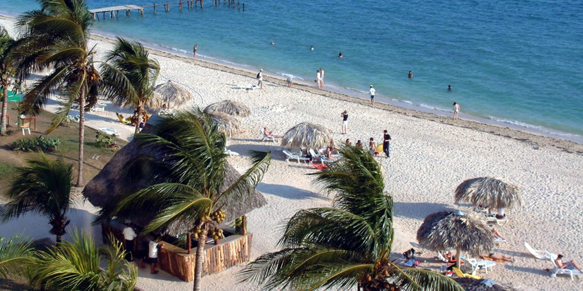 A classic Cuban beach with golden sand and vibrant marine life.