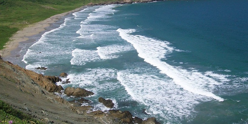 An image of Playa Brava Beach, a remote and untouched beach with powerful ocean waves
