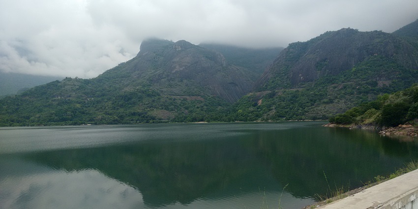 A view of the Azhiyar Dam, a significant spot among offbeat places in South India.