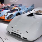 An image of a Porsche 917 series displayed at the Porsche Museum highlights its design