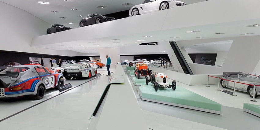 An image showing the sleek interior design and exhibits of the Porsche Museum.
