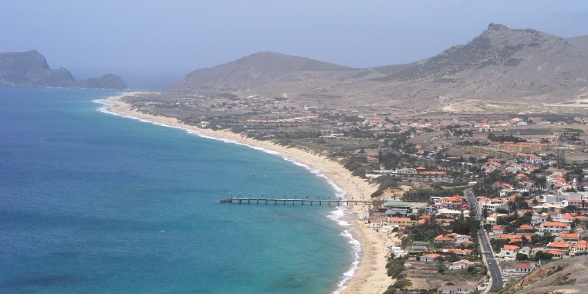 Relax on golden sands and soak in tranquility on Porto Santo, a serene Portuguese island.