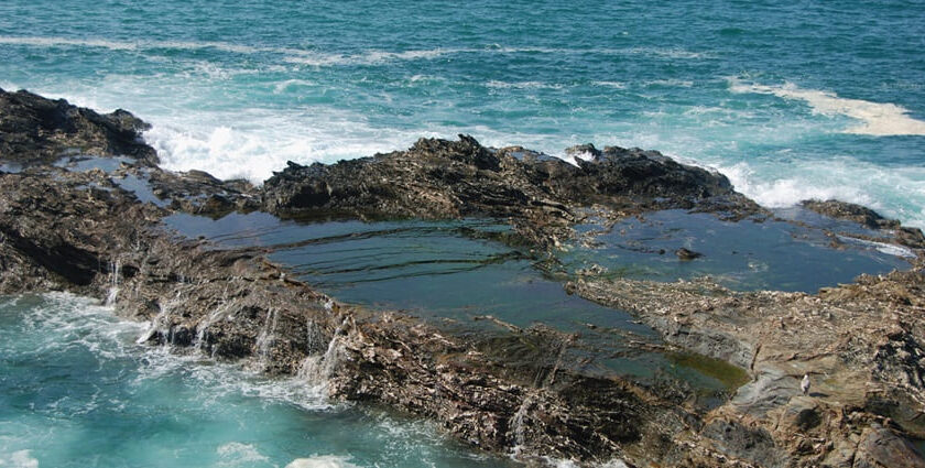 An image of the surreal views of a Portugal beach of Porto Covo with waves crashing