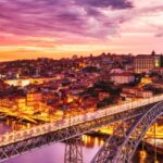 A vibrant view of a street in Lisbon, a place to witness the vibrant Portugal nightlife.