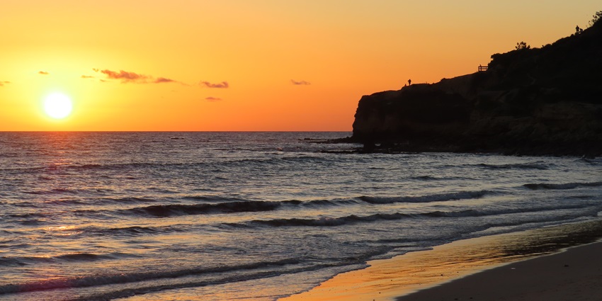 An image of a sunset view of paria da falesia, one of the most surreal Portugal beach