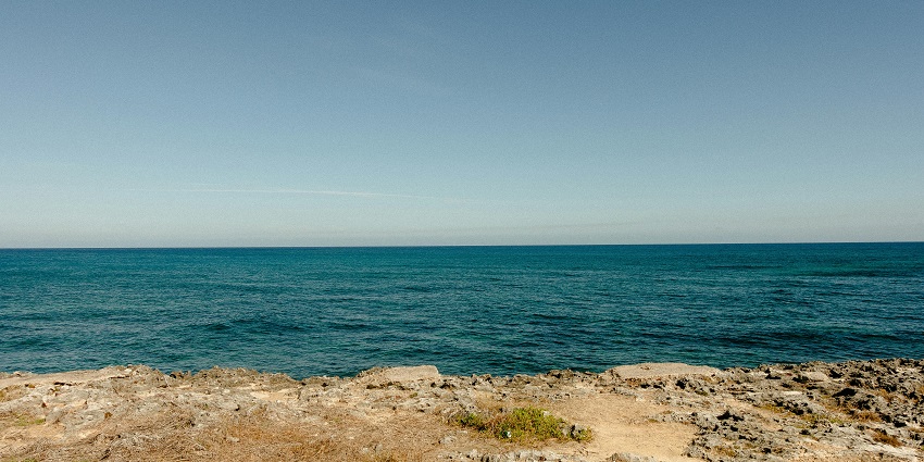 Pure crystal clear blue water at Puolo Beach, a beach near Naples at Sorrento.