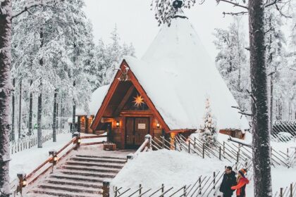 An image of the Ranua Zoo main building covered in snow, creating a winter wonderland.