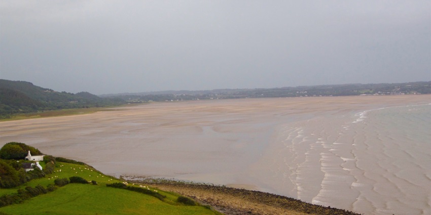 Red Wharf Bay, a picturesque bay with vast tidal sands and serene coastal scenery.