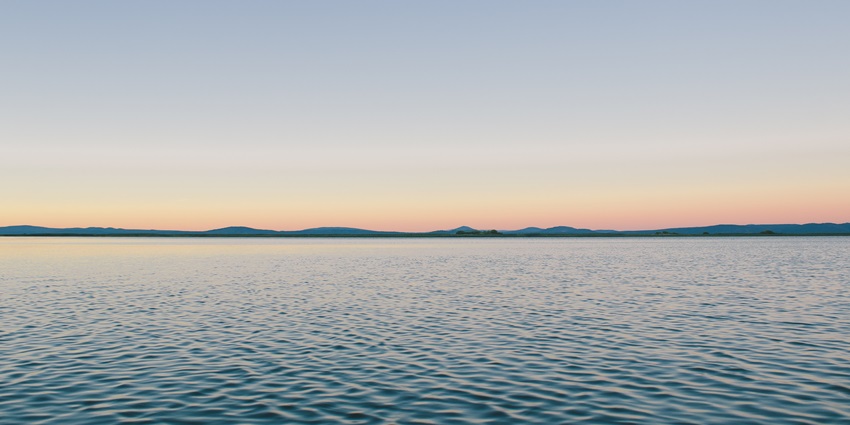 Relax by the calm waters of Kharagpur Lake, a serene spot ideal for a quiet getaway.