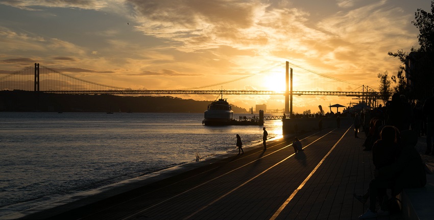 A stunning view of the Ribera das Naus by the River Tagus during sunset time
