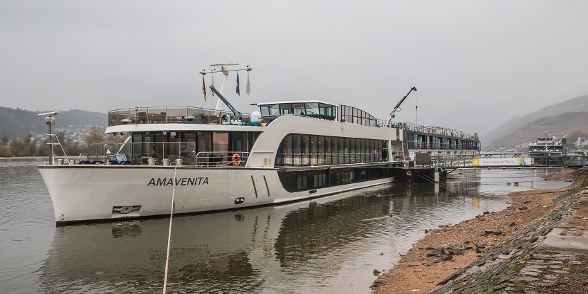 An image showing the AmaVenita river cruise boat in Rudesheim, sailing on the Rhine River.
