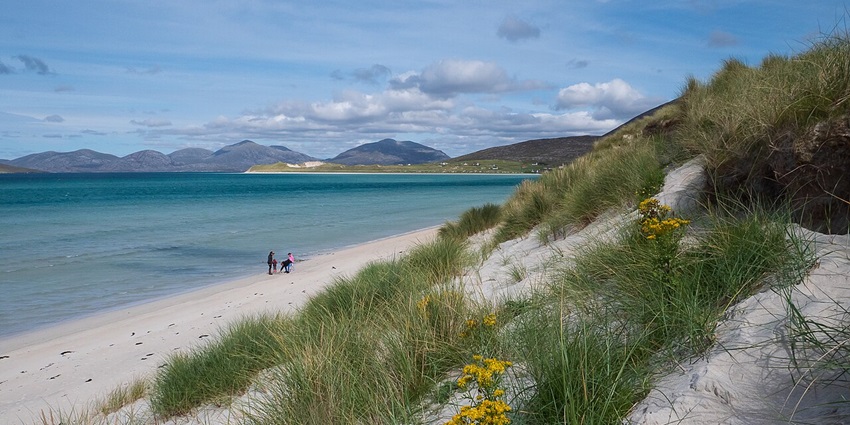 A secluded beach with crystal clear water and a tranquil landscape is the best place to celebrate Valentine’s Day in Scotland.