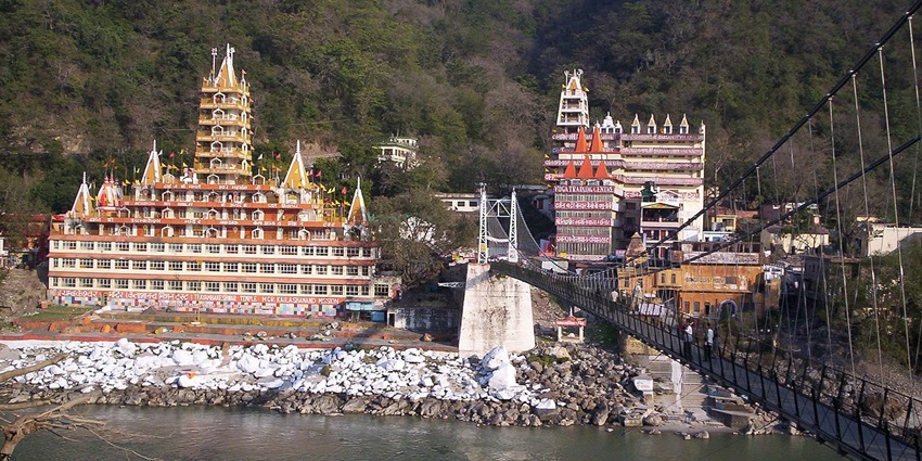 An image of a view of Rishikesh across the Laxman Jhula bridge located in Rishikesh.
