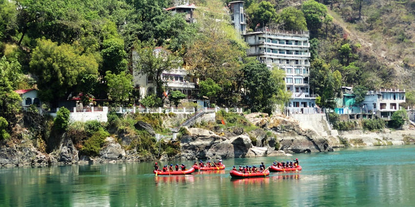 Rishikesh, offers peaceful and serene vibes - view of people ready for rafting