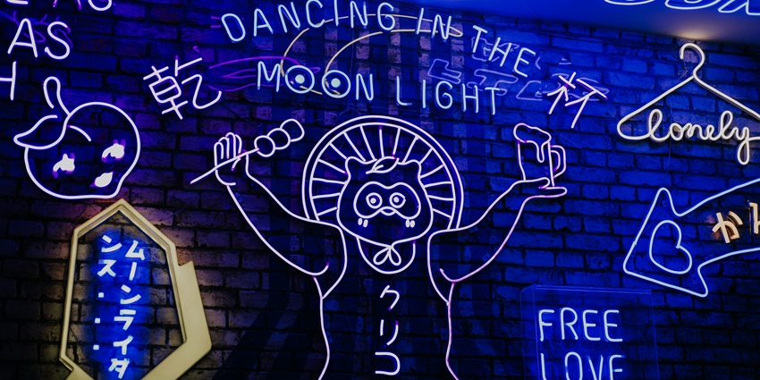 A sleek and vibrant Roppongi nightclub with dazzling lights and an elite crowd