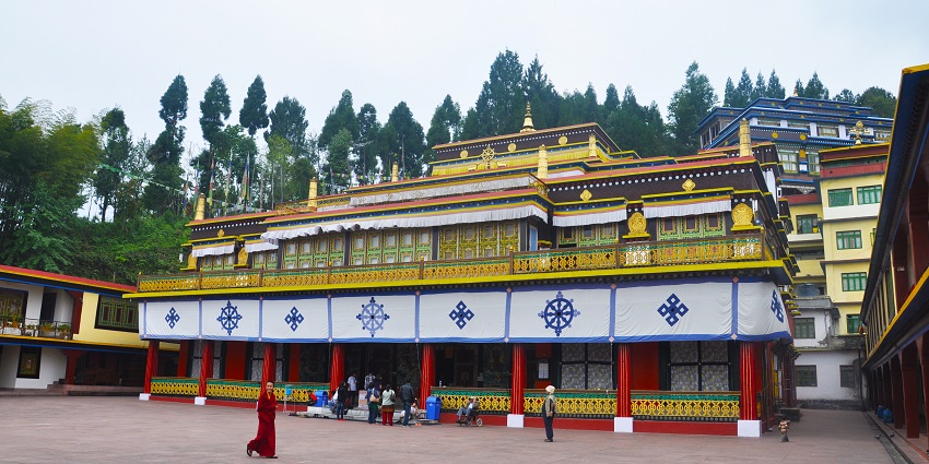 Rumtek Monastery, with its intricate architecture amidst the mountain and lush greenery.