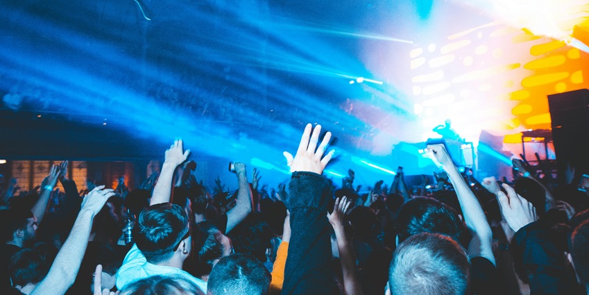 An image showing people dancing inside a club, resembling the vibrant atmosphere of Rust.