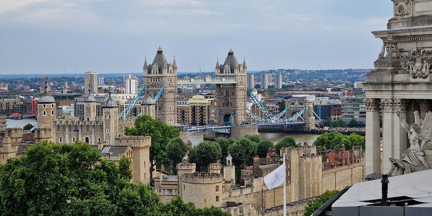 A glamorous rooftop setting with floor-to-ceiling windows showcasing panoramic London views at SUSHISAMBA