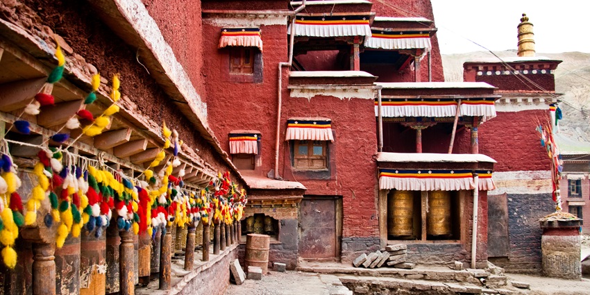Sakya Monastery with its grand architecture, intricate wall paintings, and serene mountain backdrop