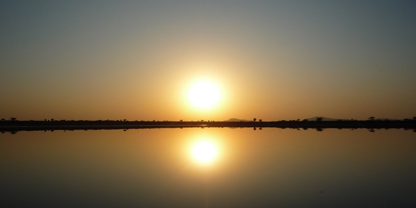 A Sunset view at Sambhar Lake, one of the famous lakes in India, with serene reflections.