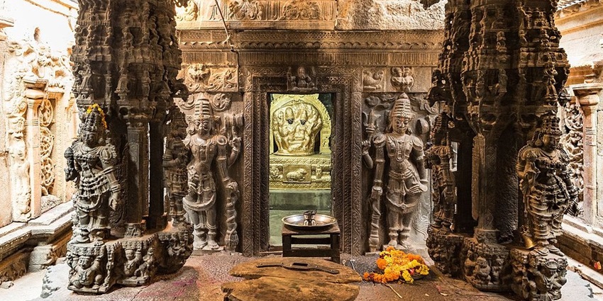 Interior of Vasanta Mantapa in Santhebennur Pushkarini with intricate and detailed carvings.