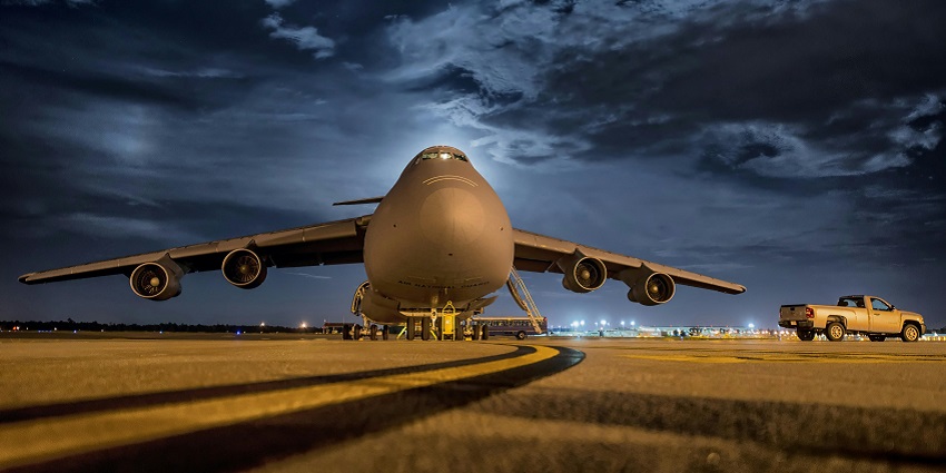 Front view of a plane with the contrasting spectacular sky in Saravane Airport.