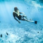 Scuba diver witnessing the serene view of the underwater marine life