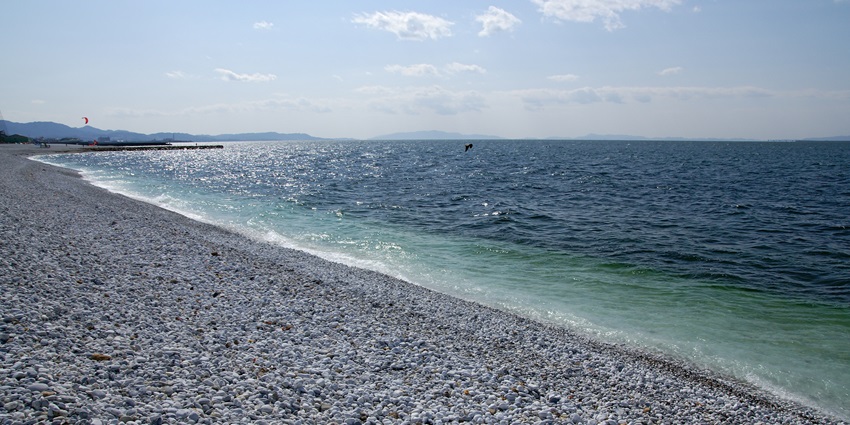 Unique beach featuring marble-like pebbles and a serene ambience.