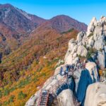 Seoraksan National Park features statues, breathtaking landscapes, hiking trails, and temples.