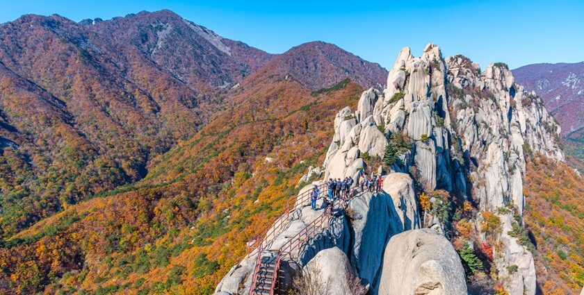 Seoraksan National Park features statues, breathtaking landscapes, hiking trails, and temples.