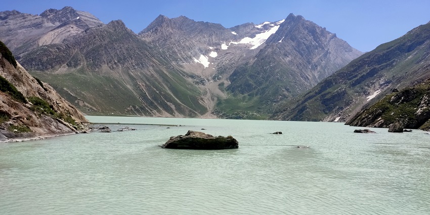 Sheshnag lakes in Jammu and Kashmir with emerald waters, and a serene landscape.