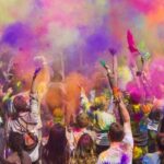 Image of crowd playing with colours during the Shigmotsav Festival in Goa, India