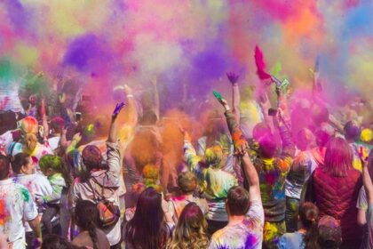 Image of crowd playing with colours during the Shigmotsav Festival in Goa, India