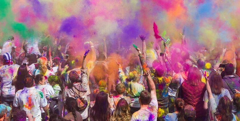 Image of crowd playing with colours during the Shigmotsav Festival in Goa, India