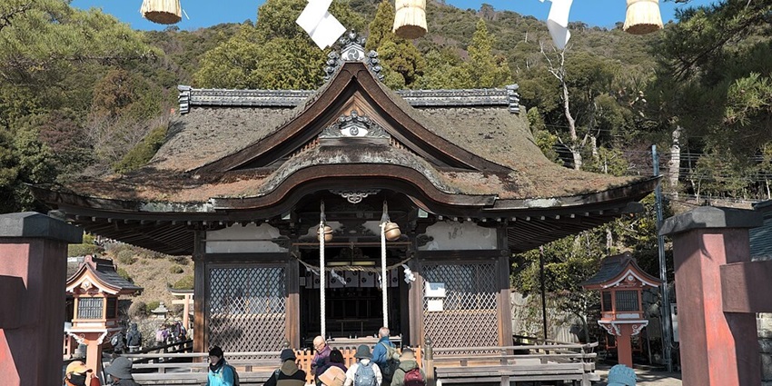 Shirahige Jinja shrine with people visiting the traditional Japanese architectural shrine.