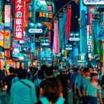 An image of a crowd roaming around at night in a shopping street complex resembling seoul