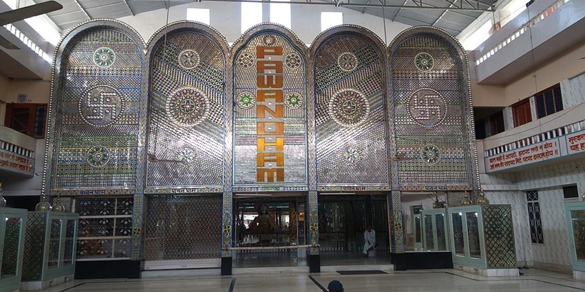 A marvel of glass artistry and devotion in ri Pawan Dham Shiva Temple.