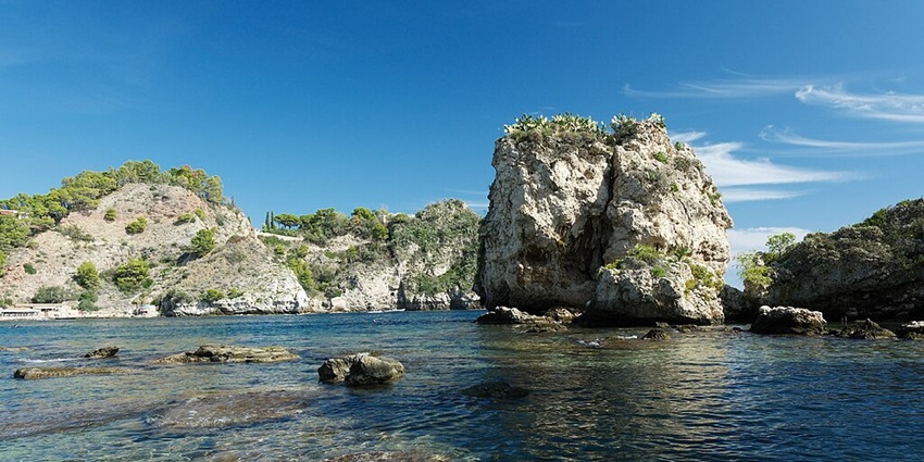 A picturesque view of the crystal clear, shallow waters at Bella Island in Sicily, Italy.