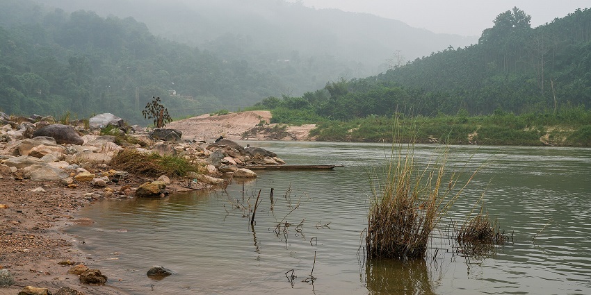 An image of the Simsang River flowing beneath the Siju Hanging Bridge in Meghalaya