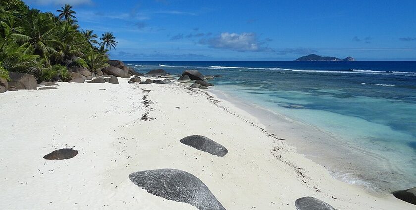 A view of a tropical heaven in Seychelles featuring golden beaches and azure waters.