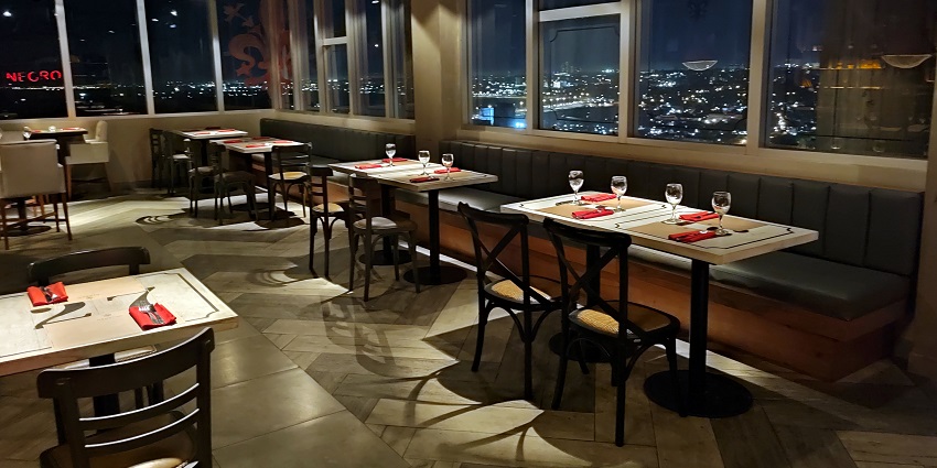 A rooftop lounge with breathtaking city views, elegant ambience, and signature cocktails.