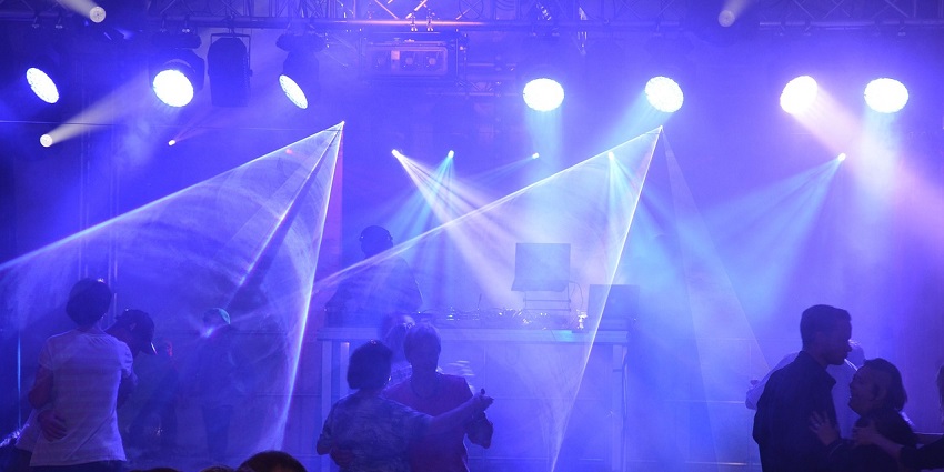 An image showing a laser disco and live concert, reflecting the vibrant Slakthuset atmosphere.