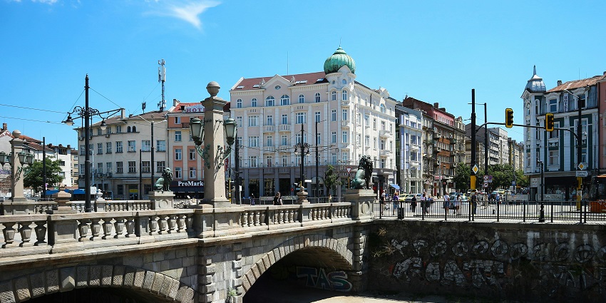 Image of a bridge over a river and building nearby - places to visit in Bulgaria